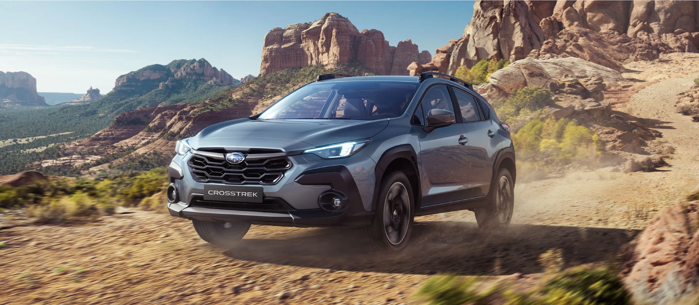 SUV híbrido modelo Crosstrek en terreno arenoso
